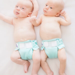 twins wearing aqua all in one reusable nappies