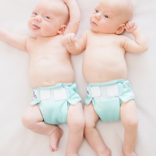 twins wearing aqua all in one reusable nappies