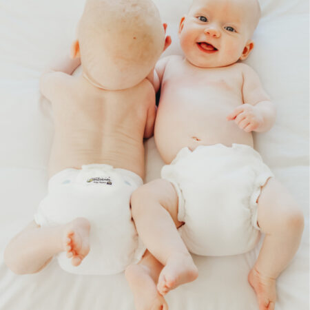 night nappy on twins smiling