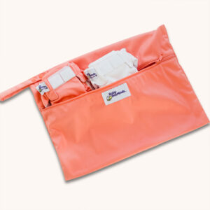 coral wetbag with two nappies inside