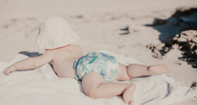 baby-wearing-reusable-swimming-nappies-on-beach