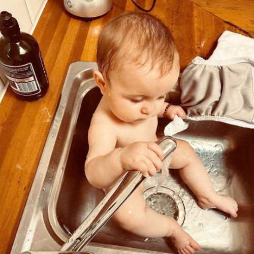baby-in-sink-with-nappy-cover