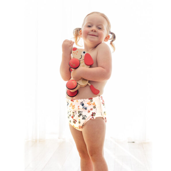 reusable training pants in paw print style on toddler